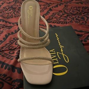 Heels in a beige color and never worn. Purchased from Fashionnova, size 10